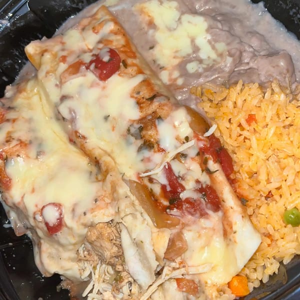 Two cheesy enchiladas with red sauce, rice, and refried beans from Patron Mexican Grill.